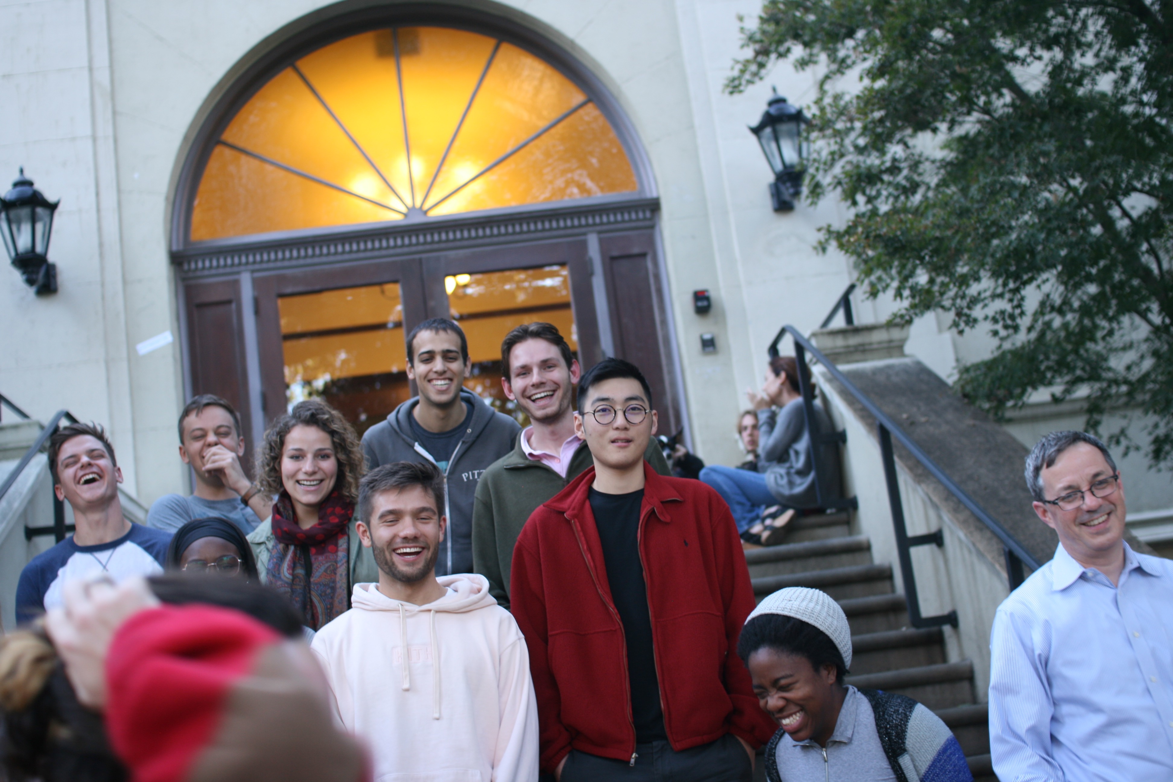 Class picture taken at a crazy angle by a camera on a tripod that is falling down